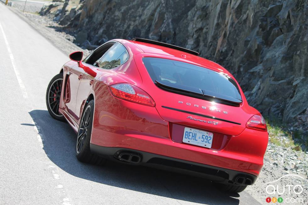 Left rear 3/4 view, wheels turned