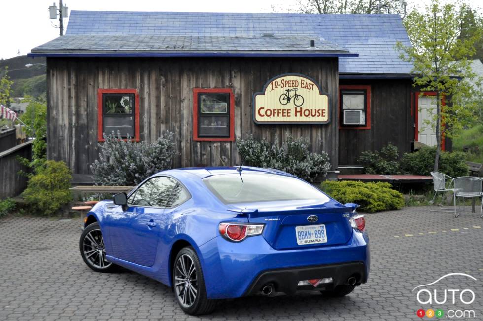 Rear 3/4 view, blue model with the wheels turned