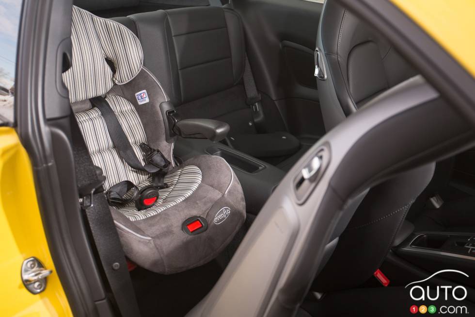 Child safety seat installed in the back