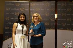Sandra Lemaître of Mazda Canada receives the Compact SUV of 2018 (Mazda CX-5) award